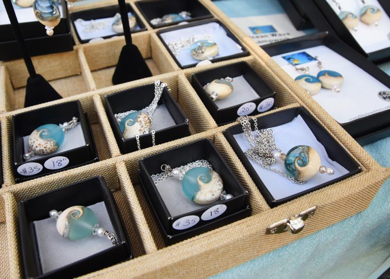 Lorraine Messitt of Crystal Blue Jewelry Co. offers beach wave pendants.