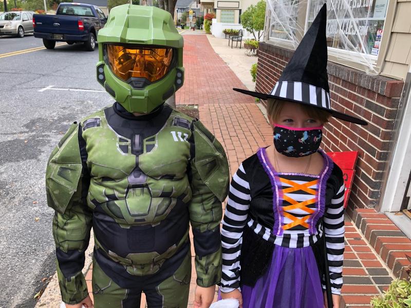 Alex, left, and Jane Mavity walk the streets of Milton looking for trinkets and treats. RYAN MAVITY PHOTO