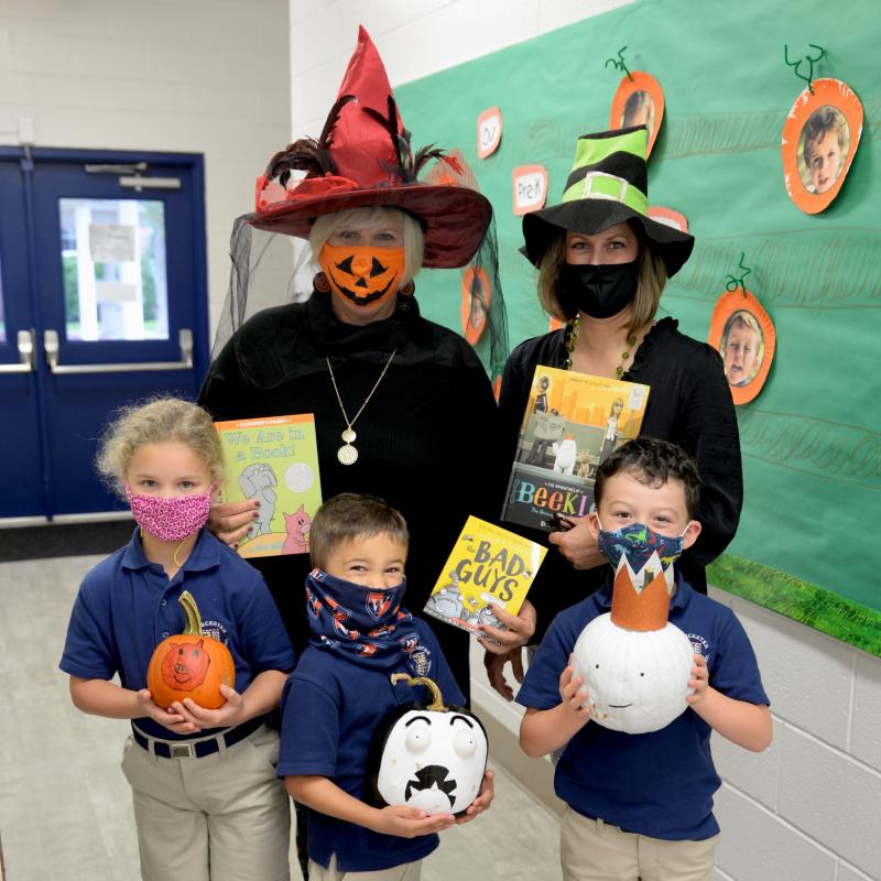 Worcester Prep students show off their pumpkins decorated to look like their favorite characters while teachers hold up the corresponding books. Shown are in back (l-r) first-grade teachers Cheryl Marshall and Angie Bunting. In front are Grace Tunnell, Lewes; Knox Luttrell, Snow Hill, Md.; and Jack Parks, Salisbury, Md. SUBMITTED PHOTOS