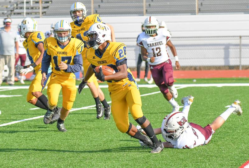 Cape’s Maurki James pulls away from a Caravel tackle attempt and returns a kick for good field position.