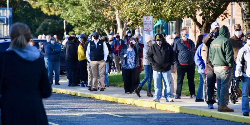 Hundreds of people are in line as polls open at Shields Elementary School in Lewes. RON MACARTHUR PHOTO