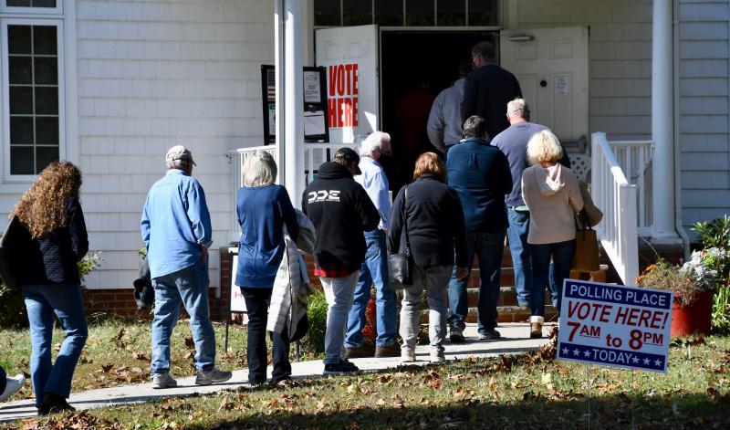 After a long wait, voters at the Coolspring Presbyterian Church fellowship hall prepare to enter the door. RON MACARTHUR PHOTO