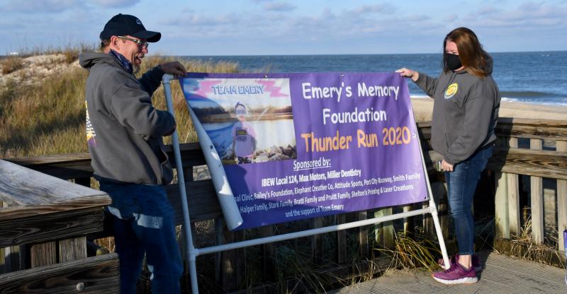 Paul and Missy Smith, Emery’s grandparents, prepare to raise the Thunder Run sign for the last time.