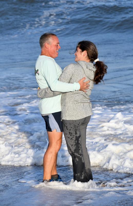 Peter and Robin Halper share a moment as they reflect on the finish of Peter’s four-month run across the country.