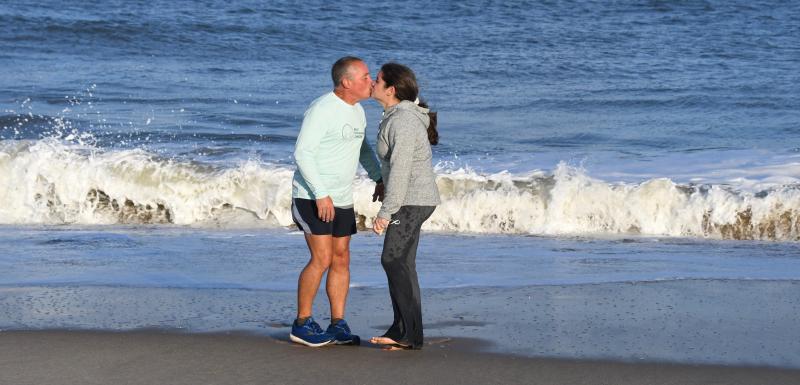 It doesn’t matter that the Atlantic Ocean water is cold as Peter and Robin Halper share a kiss at the completion of Peter’s 3,100-mile run across the country. The run, to raise funds for childhood cancer research, started July 6 in California and ended Nov. 13 at Cape Henlopen State Park. RON MACARTHUR PHOTOS