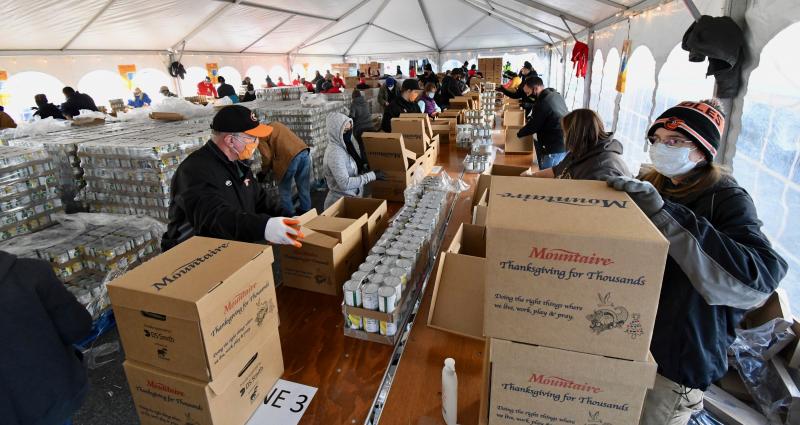 Mountaire Farms Thanksgiving for Thousands annual food packing and distribution had to adapt to restrictions caused by the pandemic. Instead of one mass of volunteers getting the work done in a few hours in a large Selbyville processing plant warehouse, smaller numbers are working under one tent in all-days shifts Nov. 19 and Nov. 20.