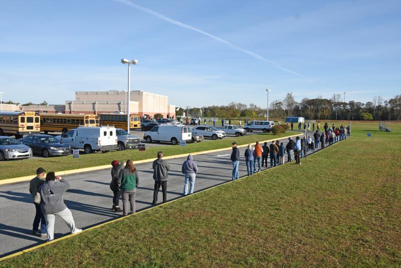 Voters at Mariner Middle School in Milton are waiting in a long line. NICK ROTH PHOTO