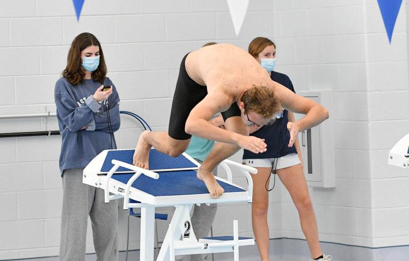 Junior Marcus Gromofsky leaves the blocks in the 50 free.