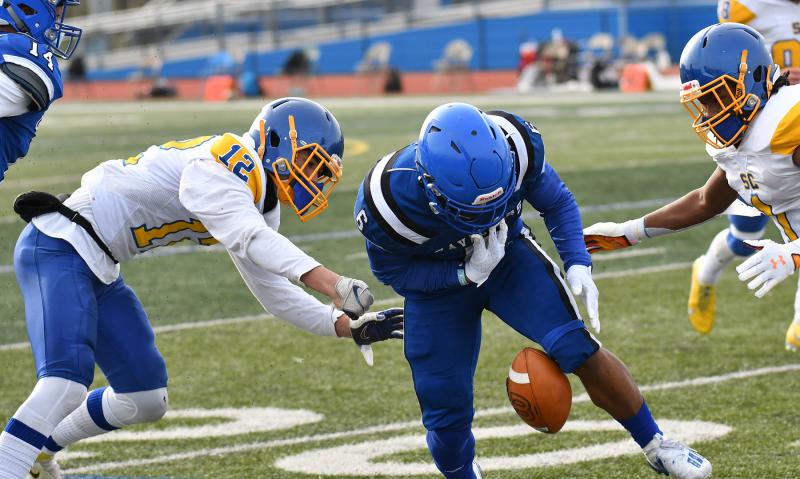 Central senior defensive back Chase Boyle punches the ball away from Middletown’s Zy'Aire Tart, and Jeremiah Wilson comes up with the recovery.