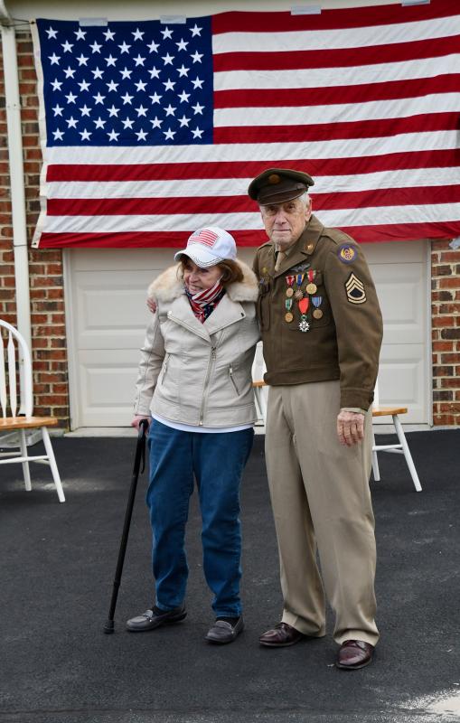 Tom Creekmore and his lady friend, Rita Cleary D’Ascenzo, welcome everyone who joins in the drive-by birthday celebration.
