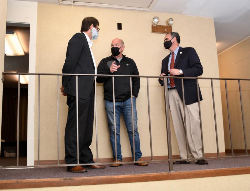 House Speaker Rep. Pete Schwartzkopf, center, and Rep. Ernie Lopez, right, give New Castle County Executive Matt Meyer a tour of the Code Purple shelter at the former Troop 7 building.