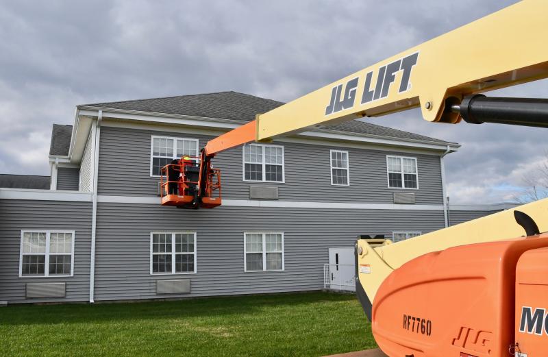 Because the Leighton family couldn’t get inside The Moorings to visit, they settled for the next best thing – a lift to their father’s and grandfather’s second-floor window.