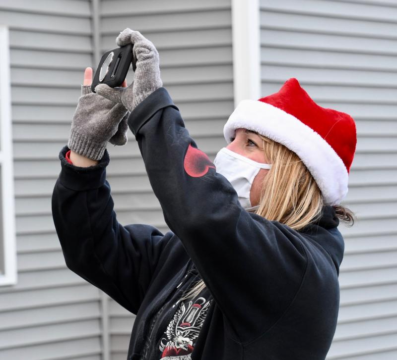 Suzy DuBois-Leighton takes video and photos of her husband’s Christmas visit with his father.