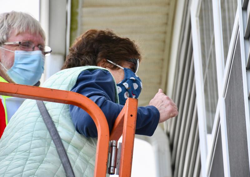 Patty Avery takes her first ride in a lift to get up close to see her friend and former neighbor.