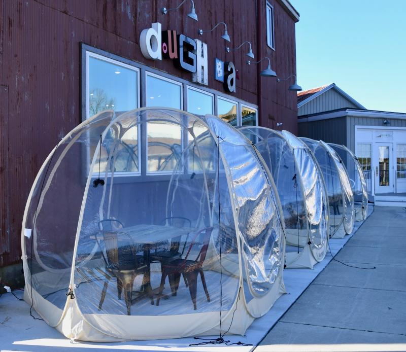 Due to restrictions placed on them by the COVID-19 state of emergency, local restaurants have been forced to reinvent themselves. Milton’s The Dough Bar owners stepped out of the box to provide eating pods outside the downtown restaurant.