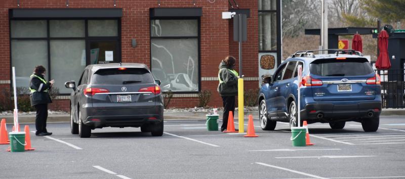 Before the lunch-crowd rush, two Chick-fil-A employees take orders. Although the fast-food restaurant’s lobby has been closed for most of the COVID-19 state of emergency, adaptions have been made to make drive-through service as efficient as possible.