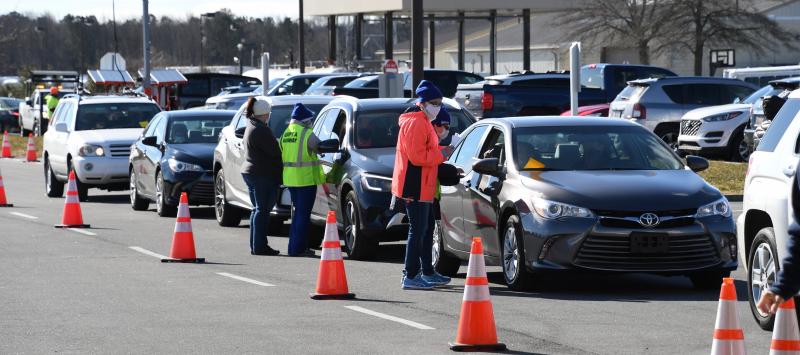 Personnel check to ensure that people have reservations before they enter the inspection lanes in Georgetown.