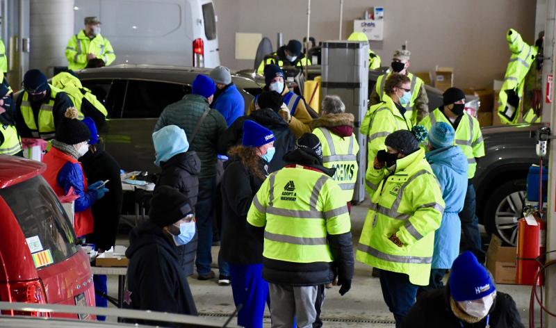 Some of the nearly 100 medical and emergency staff and volunteers fill the Georgetown DMV inspection lanes.