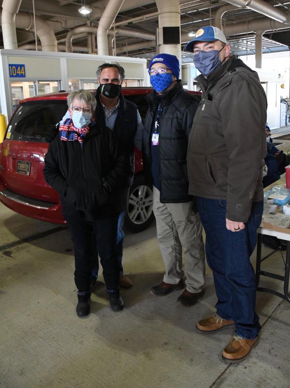 Sen. Ernie Lopez, R-Lewes, second from left, and Sen. Brian Pettyjohn, R-Georgetown, far right, are with volunteer Murt Foos of Lewes, American Legion Auxiliary Unit 17 president, and David Tam, Beebe Healthcare president and CEO at the Georgetown DMV vaccination site on Jan. 23.