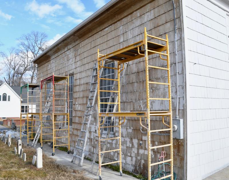 Paint has been stripped down to the bare cypress shingles. Several more treatments are planned before repainting can begin. RON MACARTHUR PHOTO