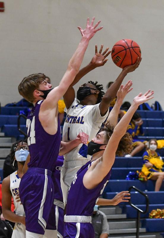 Golden Knights guard Dontae Spencer tries to loft a shot over Royals forward Zach Smith.