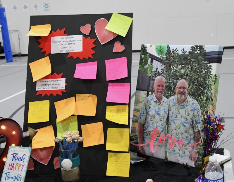 Beside a photo of Joe and Dwayne Weimer is a a message board filled with encouraging words for Joe, who is recovering from chemotherapy treatment.