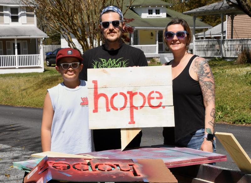 Jojo Blondin and Sean and Meesh Rhodes of Milton spread of message of hope through handmade signs that start appearing all over the area in April and May, 2020.