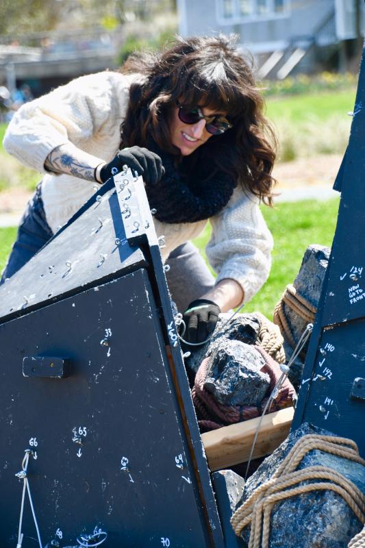 Artist Rachel Mica Weiss arranges rocks as the public art project begins to take shape on April 17, the first day of work. RON MACARTHUR PHOTO
