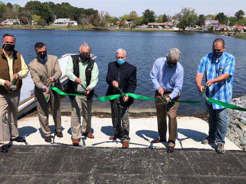 State and Milton officials took part in a ribbon-cutting on a new boat ramp and dock at Wagamons Pond in Milton. Cutting the ribbon April 20 are (l-r) Sen. Ernie Lopez, Rep. Steve Smyk, David Saveikis of DNREC, Mayor Ted Kanakos, DNREC Secretary Shawn Garvin and Jeremey Ashe of DNREC. RYAN MAVITY PHOTOS