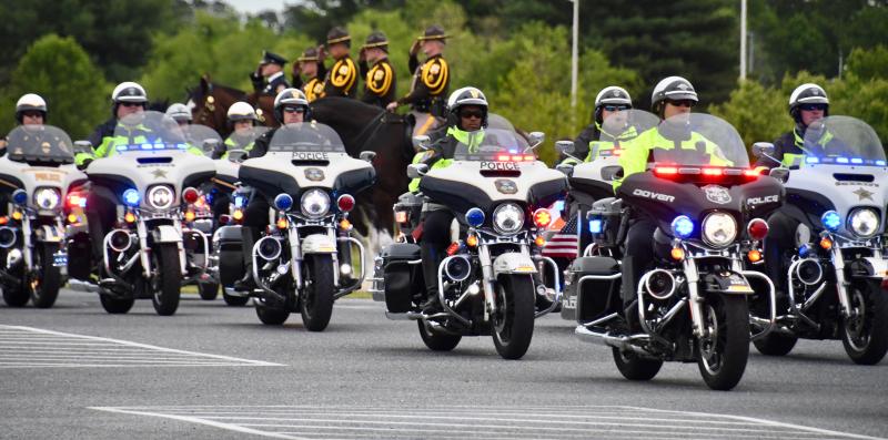 Law enforcement motorcycle police lead the procession from Delmar to Salisbury and then back again following the service.