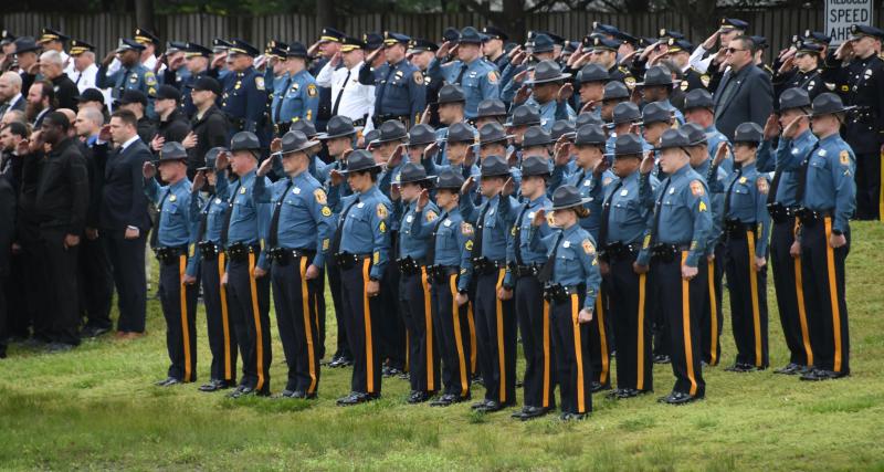 Dozens of Delaware State Police troopers give a final salute to fallen Delmar Police Cpl. Keith Heacook.