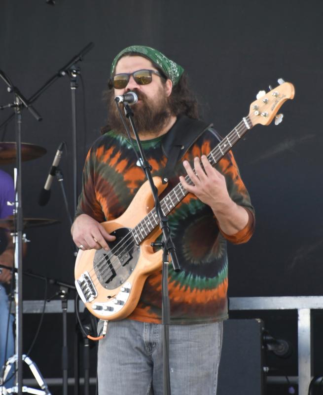 BJ Munz of Lower Case Blues performs in the early afternoon. The band has been performing their own style of blues and rock and roll in the region since 2003.