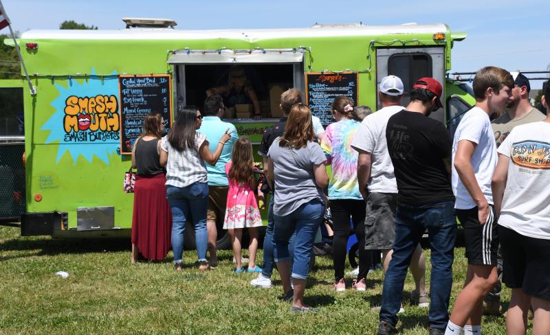Lines are long all day at all food trucks, including Smash Mouth Burgers, set up at Hudson Fields. All food trucks and vendors donated a portion of their proceeds to support the effort.