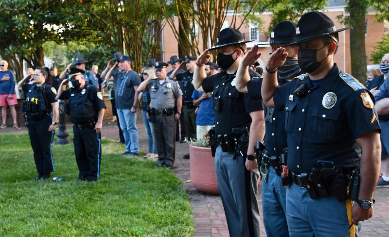 Police officers from throughout Sussex County salute the flag during the playing of the national anthem at a May 17 law enforcement support rally on The Circle in Georgetown. RON MACARTHUR PHOTOS