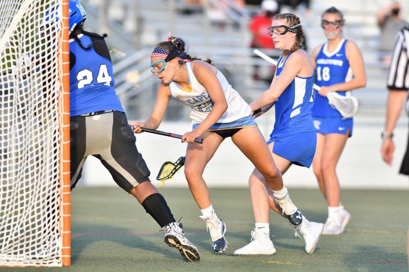 Molly Mendez gets pushed into the crease.