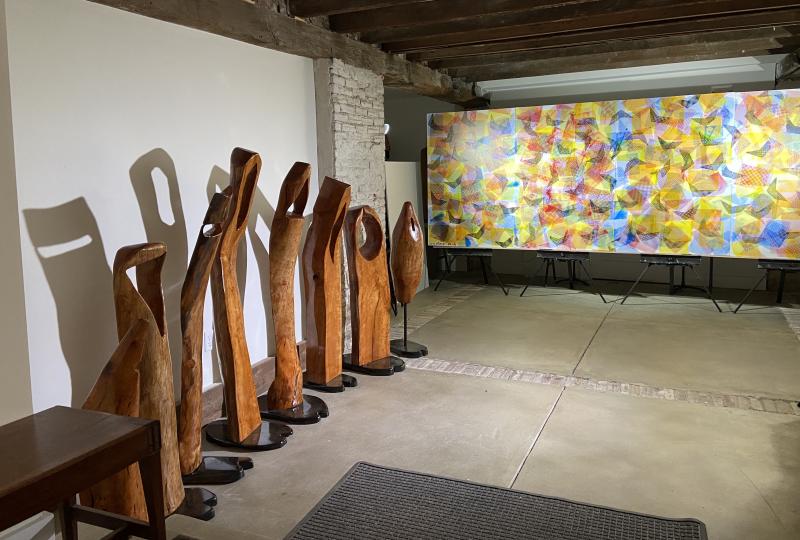 “Witnesses,” a community of eight wood sculptures by Roy Fitzgerald and “Hovering Spirits,” Mark Harris’ silkscreen with half a million dots representing those who had died in the U.S. from COVID-19 as of mid February 2021, are displayed at St. Peter’s Church in downtown Lewes through Sunday, May 30. SUBMITTED PHOTO