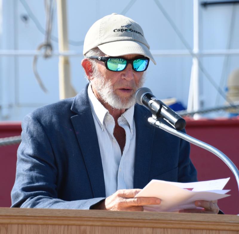 Dennis Forney, Cape Gazette publisher emeritus, reads the background of a hall of fame inductee.