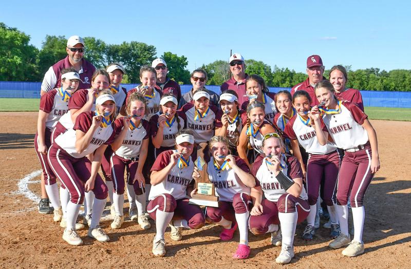 Sharing the winning trophy moment were in back (l-r) coaches Keith Holdsworth, Randy Johnson, Sharon Hunter, Tom Sheehan, Petey Peterson and Caroline Reid. Standing are Rylee Maloney, Lauren Dickerson, Brooke Holdsworth, Morgan Moxley and Zayda Rocke. Leaning are Mady Parton, Haley Grygo, Kendall Browne, Veronica Diomede, Mikayla Walsh, Olivia Rexrode, Laila Rocke, Katrina Barran and Paige Richardson. Kneeling are Daniele Bebenidictis, Mia Guerrieri and Jess Walter.