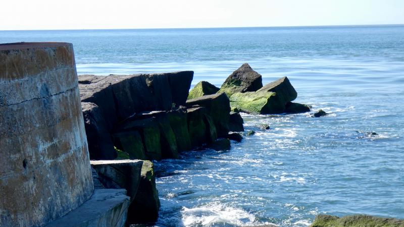 This closer view shows how the shifting stones have taken on an irregular profile. It also shows the proximity of those stones to the concrete base of the lighthouse. RED MOULINIER PHOTO