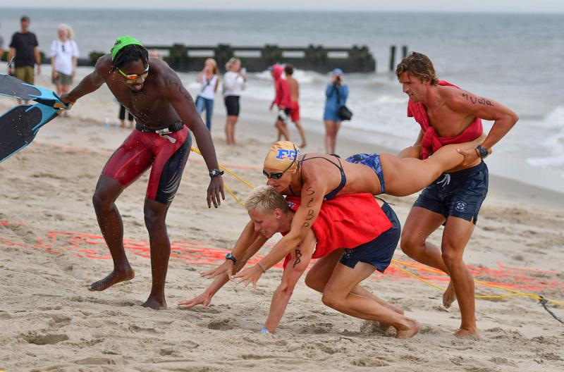 Sea Colony Beach Patrol’s landline competitors regain their composure after taking a spill at the finish. Shown are (l-r) Marlan McElroy, Drew Meininger, Lexie Santor and Garret Karres.