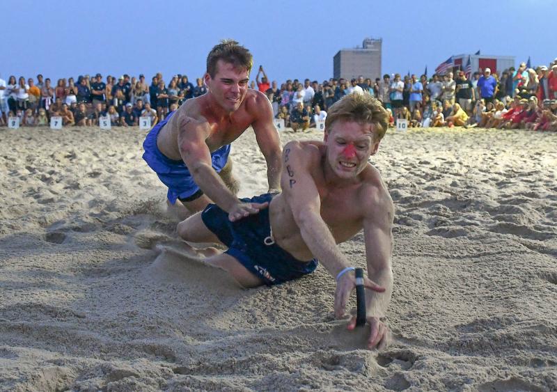 Bethany Beach Patrol’s Brendan Keane, right, takes the victory in beach flags over Delaware State Parks’ Connor Staudmyer.
