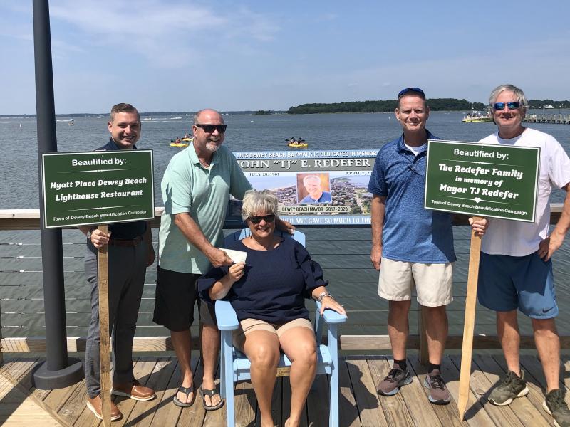 Donations to the Dewey Beach beautification project are continuing, thanks to monetary gifts from the Redefer family and Hyatt Place/Lighthouse Restaurant. Gathered on the Dewey Beach Baywalk are (l-r) Hyatt Place General Manager Drew DiFonzo, Commissioner Paul Bauer, Bobbie Redefer, Town Manager Bill Zolper and marketing committee Chair Drew Martin. SUBMITTED PHOTO