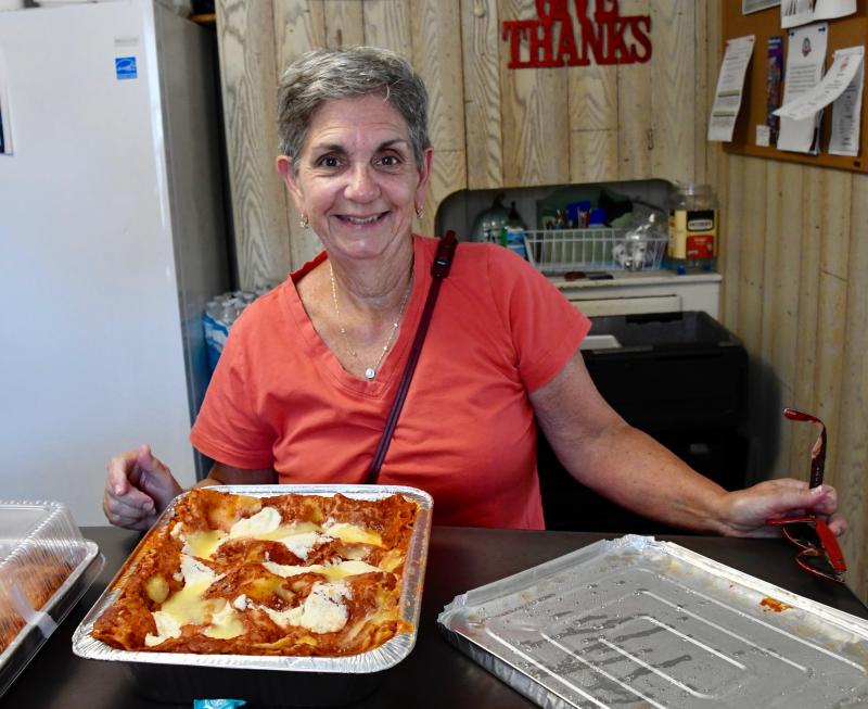 Vivian Goodman, who lives in Ocean View, drops off a tray of lasagna at Shepherd’s Office. The active volunteer provides lunch on Thursdays.