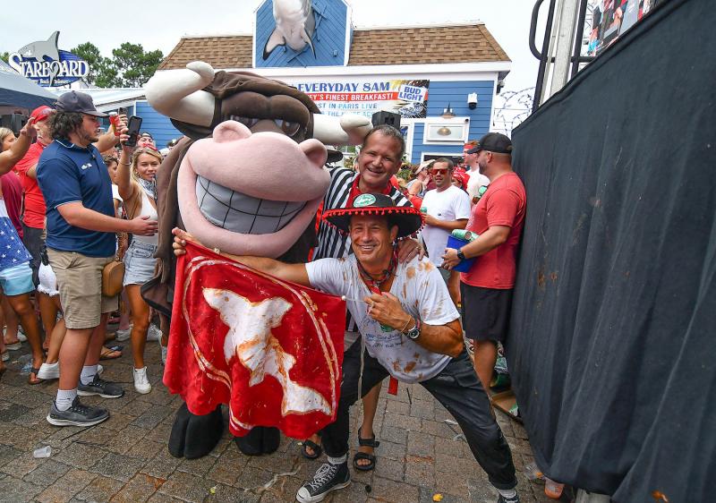 Matador Sam Calagione and referee Ken Garfinkel pose with the bull after the post-run fight. DAN COOK PHOTO