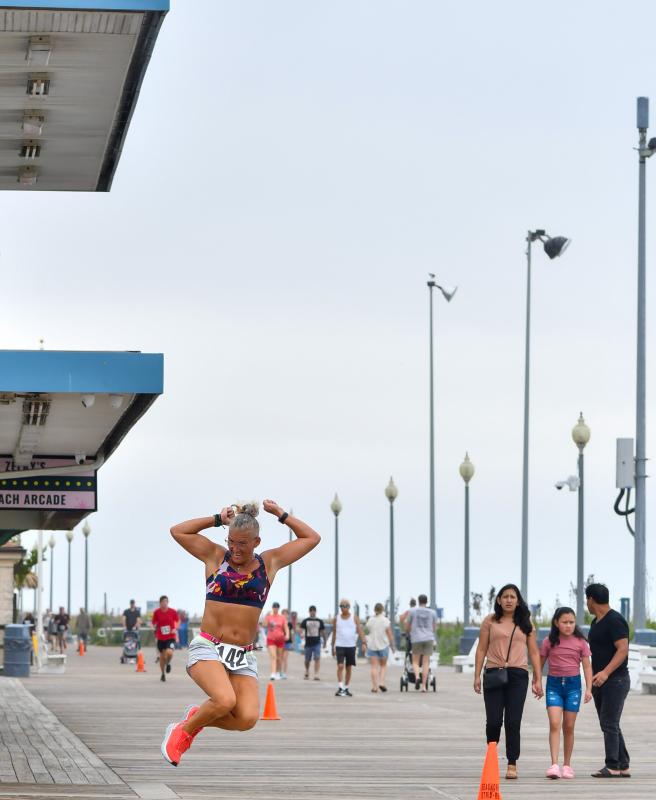 Kim Geyer leaps to victory in the women’s masters race.