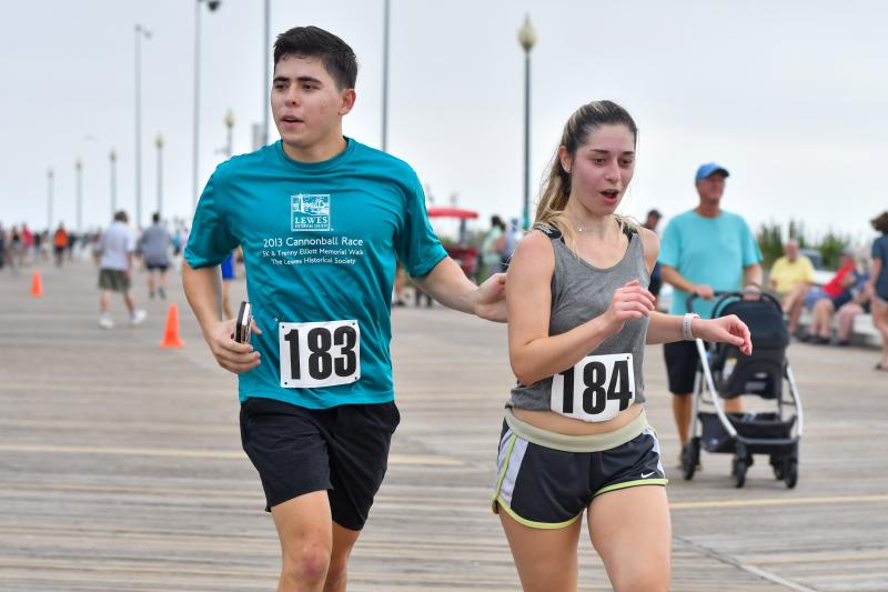 Xavier Castillo, 22, and Vanessa Barlow, 22, run 32:53. Xavier’s been running Striders races since he was 8 years old. He is now working on a masters in computer science at UVA.