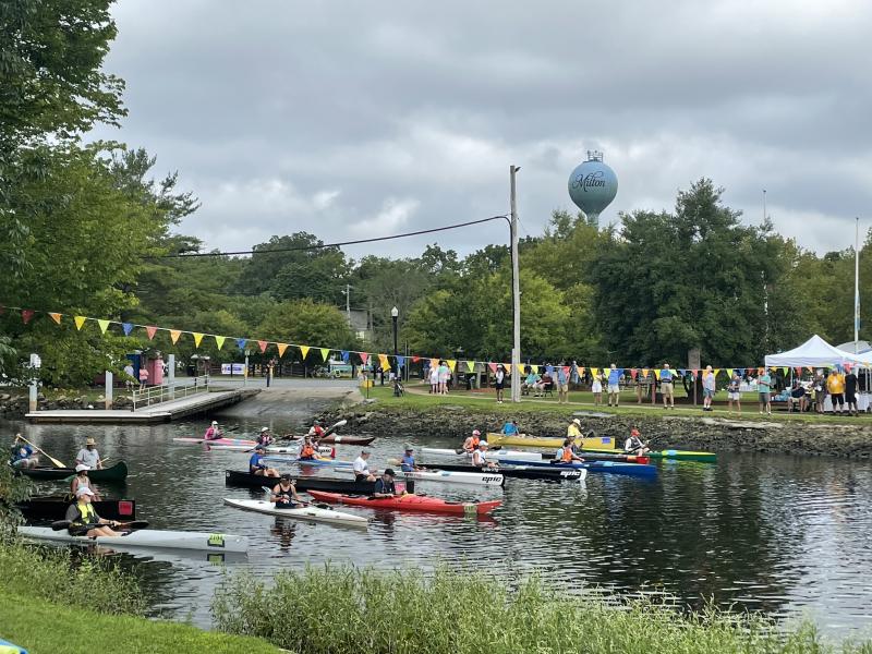 Kayak and canoe racers take off from the dock at Milton Memorial Park, on their way to the Route 1 bridge and back. The kayak race is sponsored by Irish Eyes Milton. NICK ROTH PHOTO
