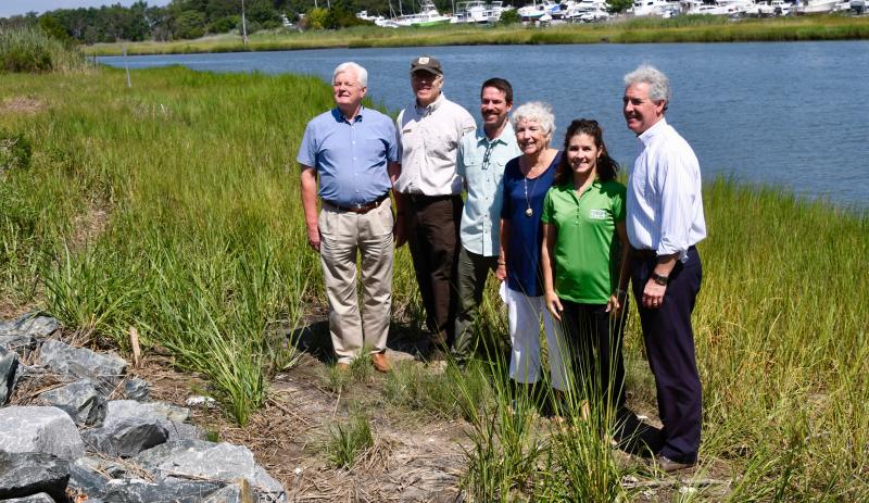 Attending the event to celebrate National Water Quality Month in Lewes are (l-r) Lewes Mayor Ted Becker; Brian Marsh, team leader of the U.S. Fish & Wildlife Service's Delaware Bay Estuary Project; Josh Moody, Delaware Estuary restoration manager; Libby Owen, Lewes Historical Society board of trustees chair; Alison Rogerson, DNREC Wetlands Monitoring and Assessment Program; and DNREC Secretary Shawn Garvin.