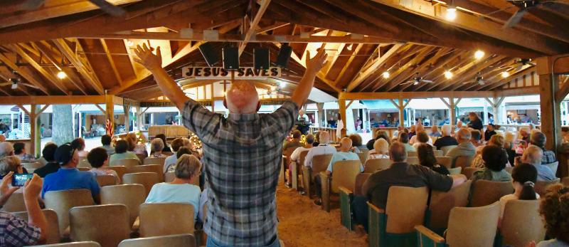 A camp-goer is overcome with the spirit during a ceremony of traditional hymns on the last night of services.