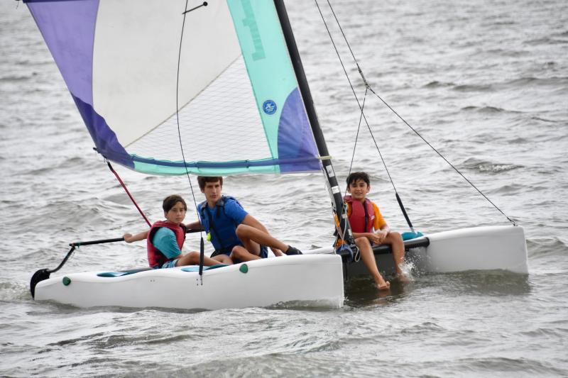 YMCA Explorers sailing on a Hobie with LYC instructor Nick Holoman are Shalin Narula and Dylan Clarke.